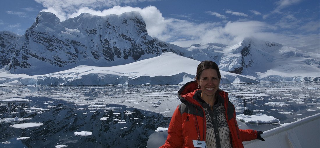 student in front of Antarctic ice field